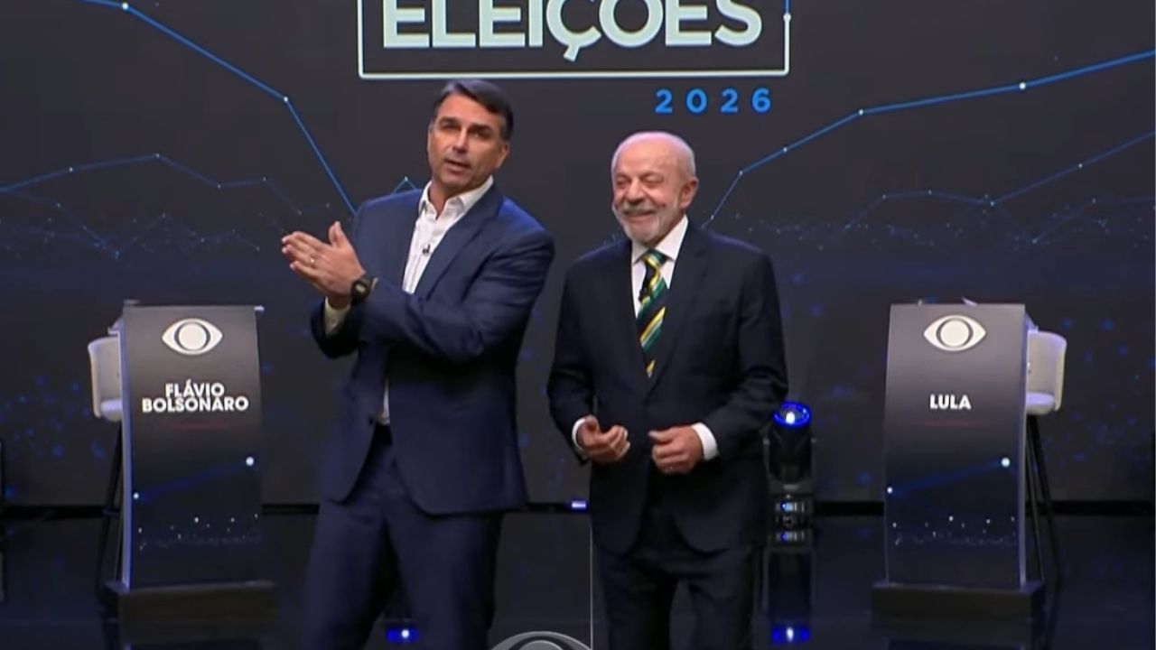 Flávio Bolsonaro e Lula durante o debate na Band TV | Reprodução/Band TV