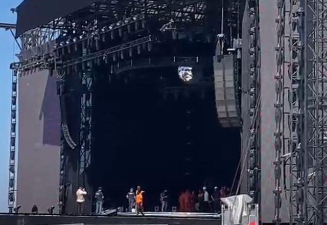 De máscara, Madonna canta em passagem de som em Copacabana