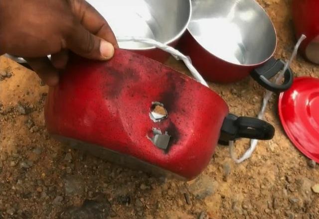 Panela com marca de tiro