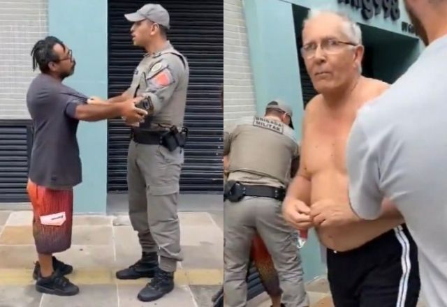 Homem negro vítima de agressão é algemado por policiais enquanto suposto agressor sai.Crédito: Reprodução
