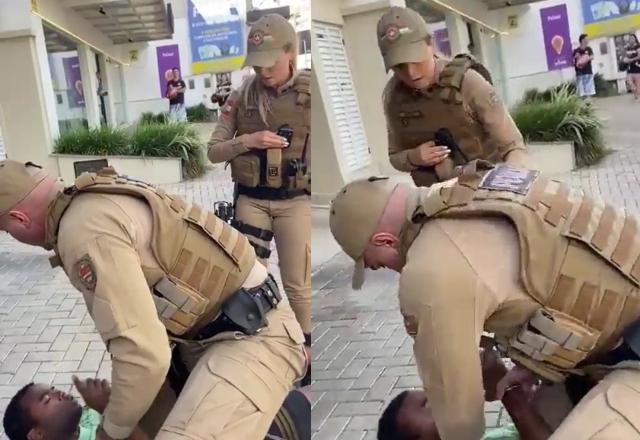 policial escondendo câmera corporal