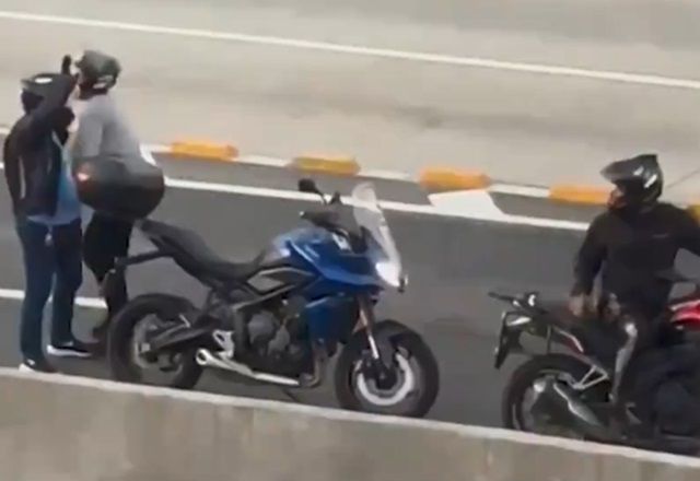 Bandidos interditam principal avenida do Rio para assaltar