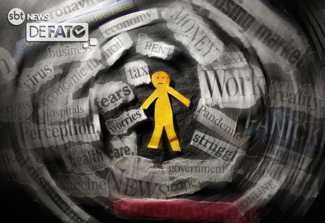 um boneco de papel que imita um homem cercado de papeis com informações falsas